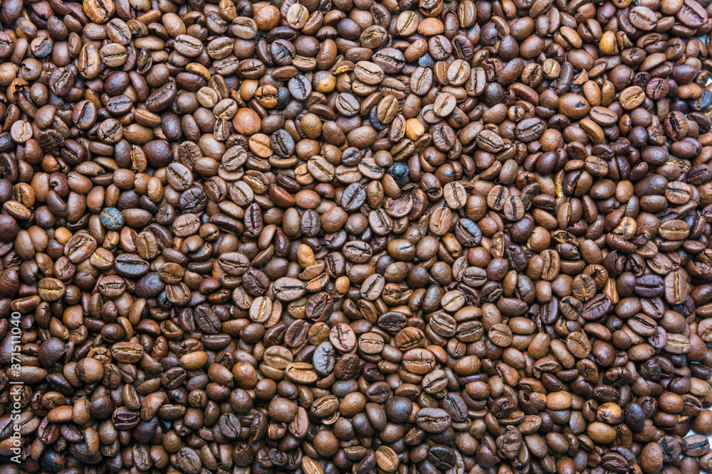 Background of brown color from roasted coffee beans top view