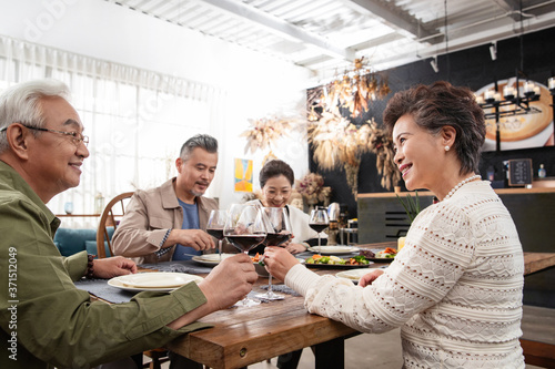 Elderly people in the restaurant together happy meals photo