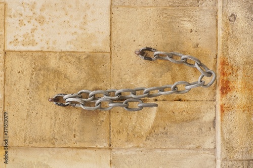 Decorative chain on one of the tenement houses in Krakow at Florianska Street photo