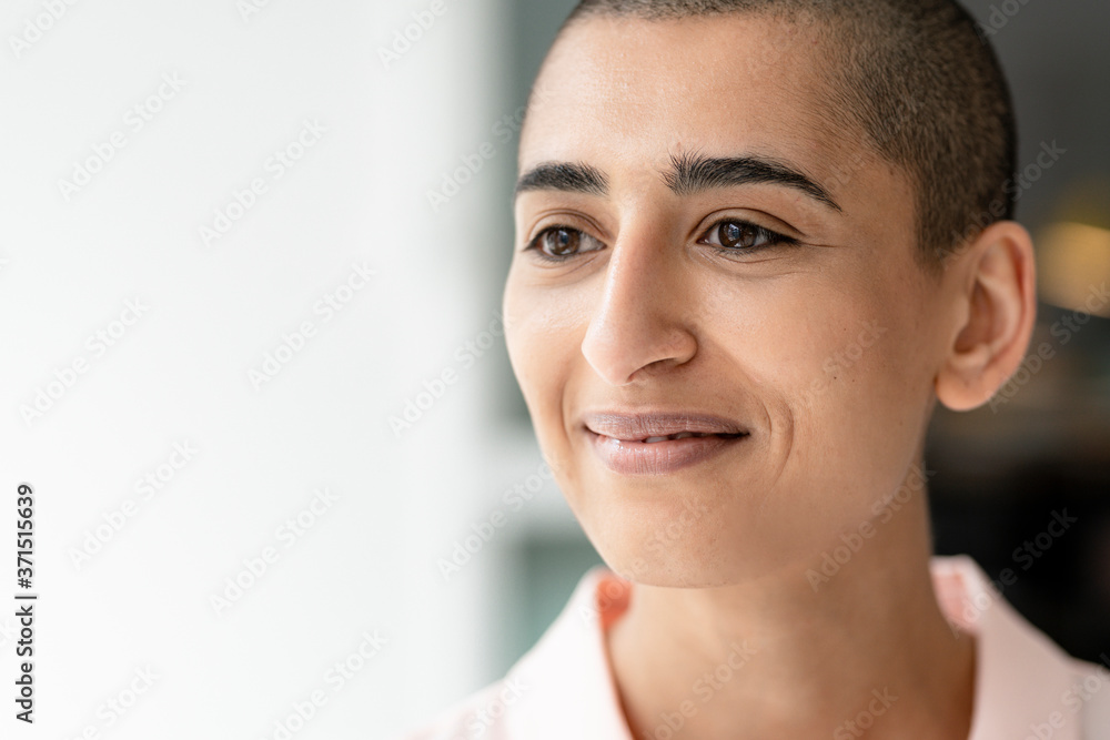 Portrait of a confident woman with short hair looking sideways Portrait of a confident woman with short hair looking sideways