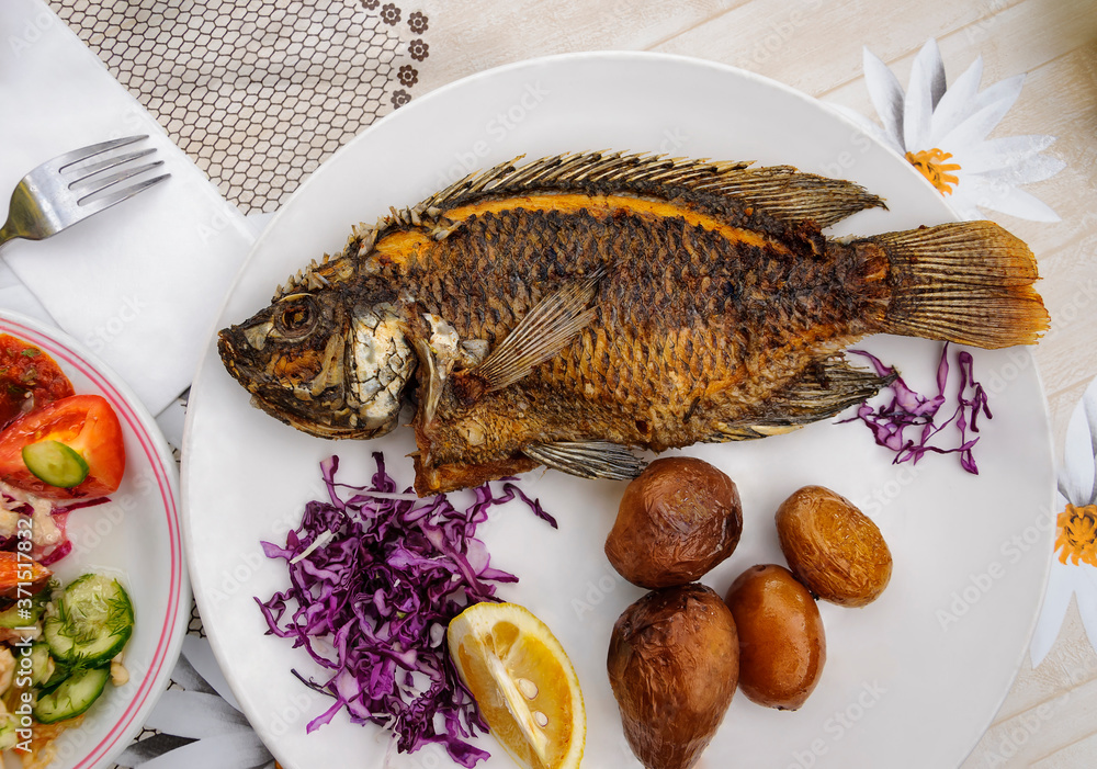 Fried tilapia fish from Tiberias Lake (the Sea of Galilee, Gennesaret