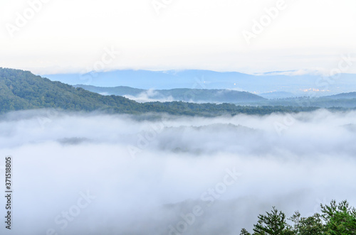 fog in the valley below a scenic overlook along the skyway motorway in the talladega national forest, alabama, usa