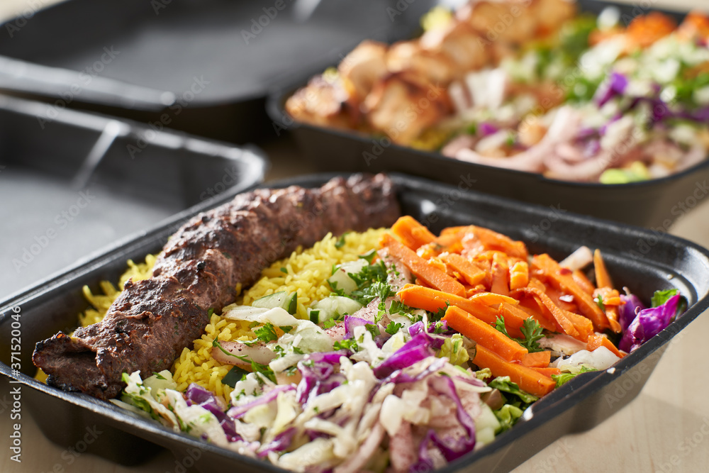 greek beef souvlaki take out container with rice and pickled vegetables