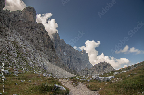 On trail from Coldai refuge via Coldai lake to Vazzoler refuge, along Civetta mountain range from north to south, stage 9 of Alta Via 1 classic long trek in the Dolomites, South Tirol, Italy. photo