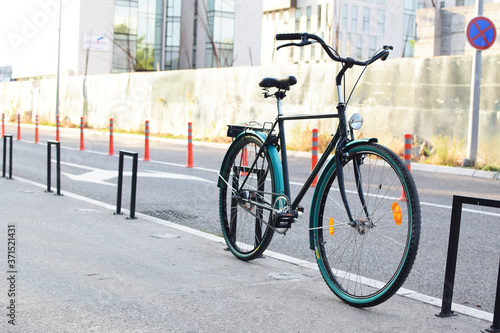 Green city bike on street, pedal, bicycle