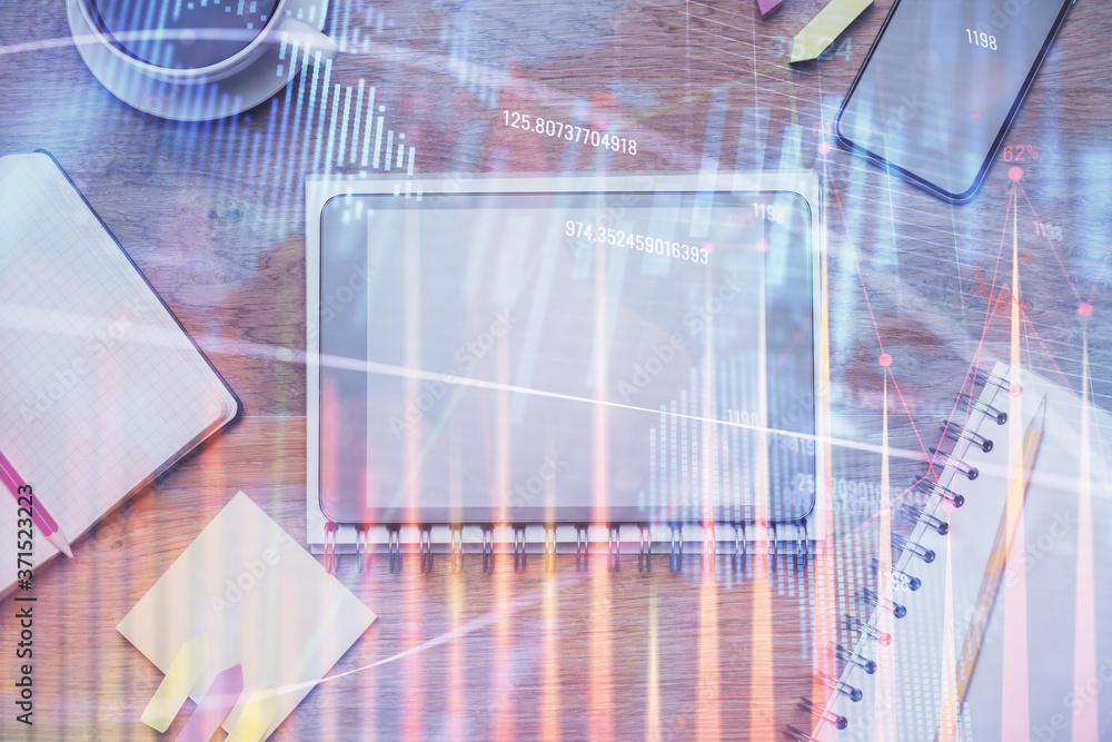 Double exposure of forex chart hologram over desktop with phone. Top view. Mobile trade platform concept. Double exposure of forex chart hologram over desktop with phone. Top view. Mobile trade platform concept.