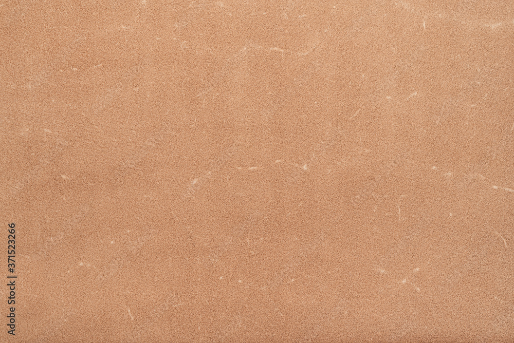 Fototapeta premium Leather. Close up beige color suede texture background