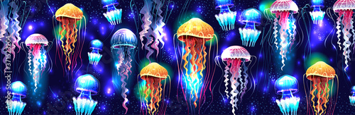Glowing vivid transparent underwater jellyfishes