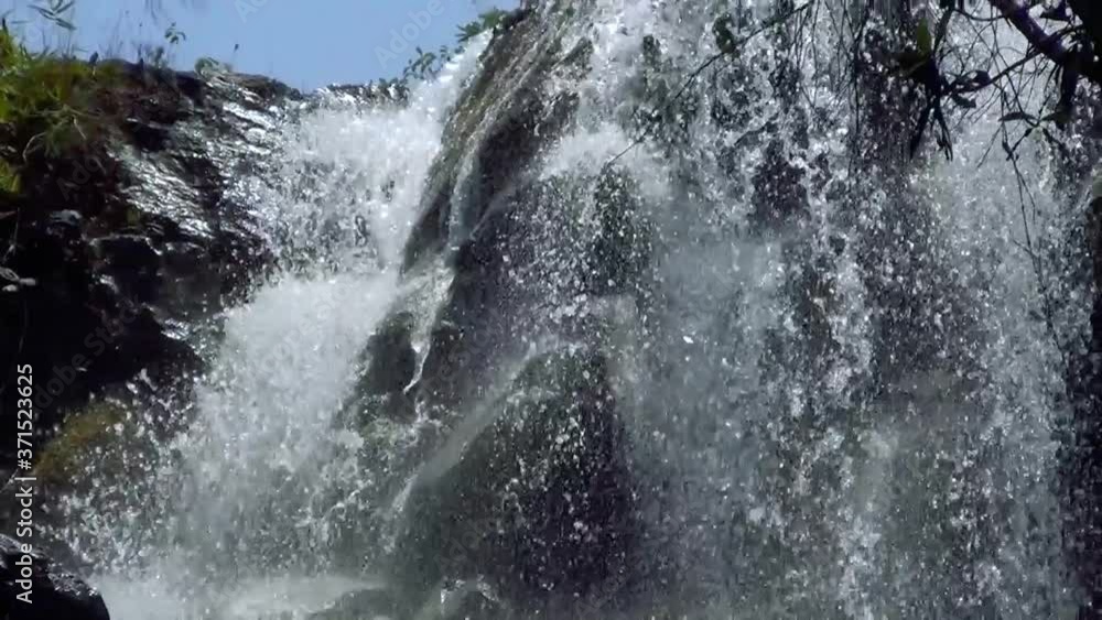 Looking up from a waterfall top. A water curtain wall of a large waterfall at the brazilian savannah. Looking up from a waterfall top. A water curtain wall of a large waterfall at the brazilian savannah.