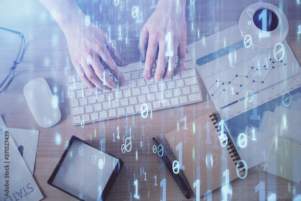 Double exposure of man's hands typing over computer keyboard and data theme hologram drawing. Top view. Technology concept. Double exposure of man's hands typing over computer keyboard and data theme hologram drawing. Top view. Technology concept.