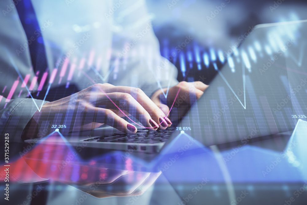 Double exposure of businesswoman hands typing on computer and forex chart hologram drawing. Financial analysis concept. Double exposure of businesswoman hands typing on computer and forex chart hologram drawing. Financial analysis concept.