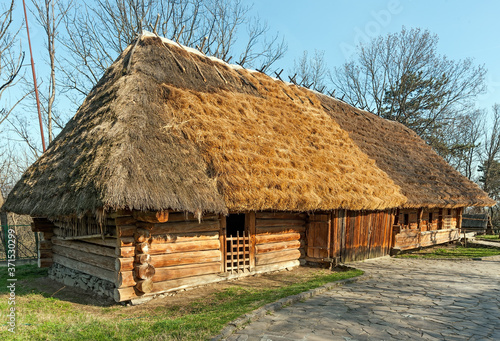 Ukrainian traditional countryside cabin with straw roof