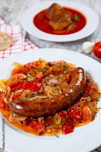 Sausage with vegetables on a plate