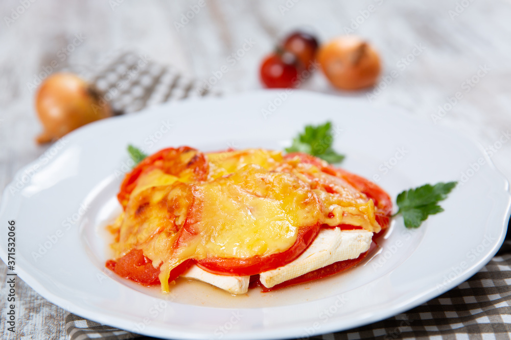 Sliced tomatoes and cheese and baked