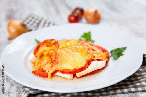 Sliced tomatoes and cheese and baked