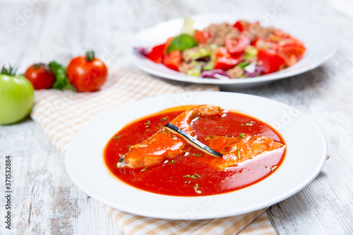 Fish soup in a white plate