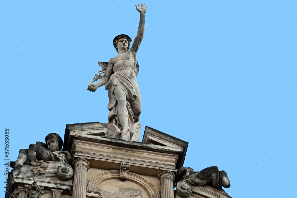 Statue of Mercury on a building facade in city Lviv, Ukraine
