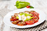 Salad tomato with cheese and paprika
