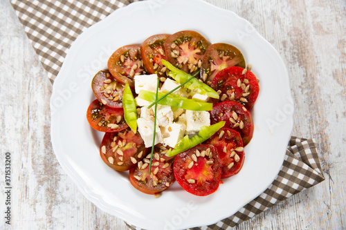 Salad tomato with cheese and paprika