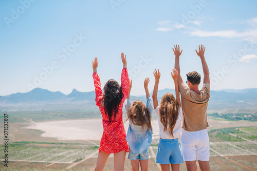Happy family on vacation in the mountains