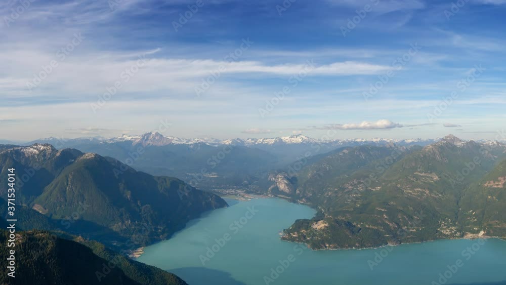 Cinemagraph Continuous Loop Animation. Aerial View of Howe Sound and Beautiful Canadian Mountain Landscape during sunny and cloudy day. Taken near Squamish and Vancouver, British Columbia, Canada. Cinemagraph Continuous Loop Animation. Aerial View of Howe Sound and Beautiful Canadian Mountain Landscape during sunny and cloudy day. Taken near Squamish and Vancouver, British Columbia, Canada.