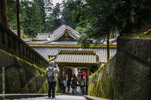 Person using a Cellphone to Take a Photo of a Temple