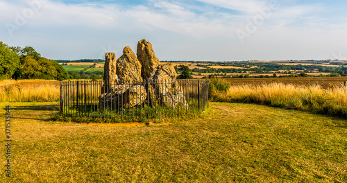 A panorama view of a cluster of neolithic stones in the Cotswold hills, UK in the summertime