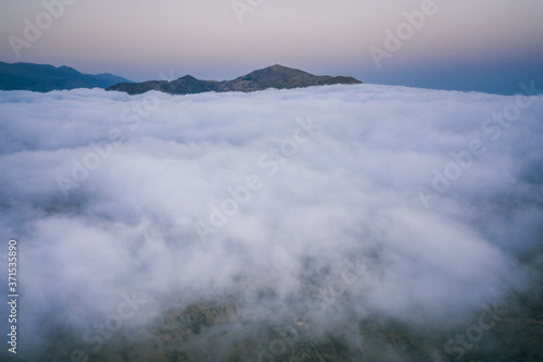 Sunset over the clouds and rugged south coast of Crete