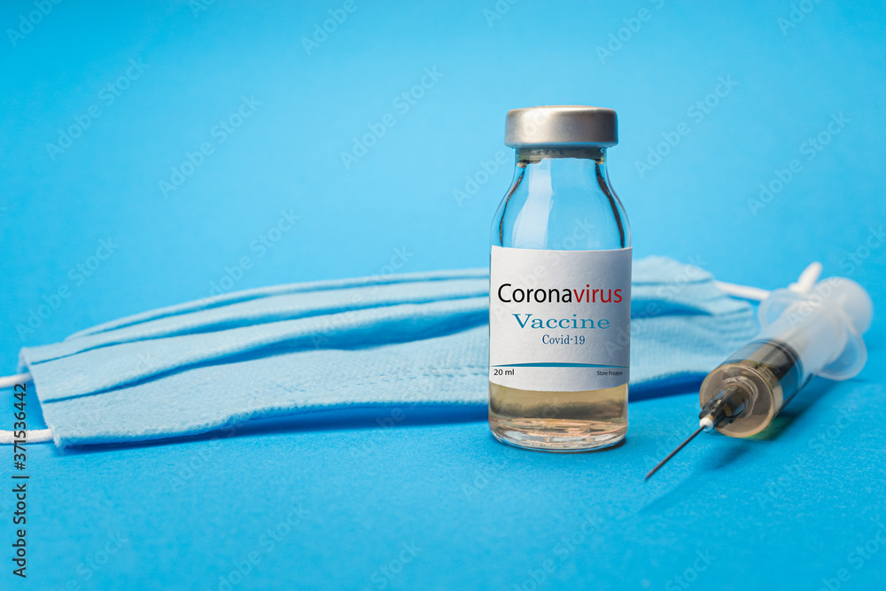 Obraz premium Coronavirus vaccine concept and background. New vaccine sputnik-v isolated on blue background. Covid-19, 2019-nCov pandemic.