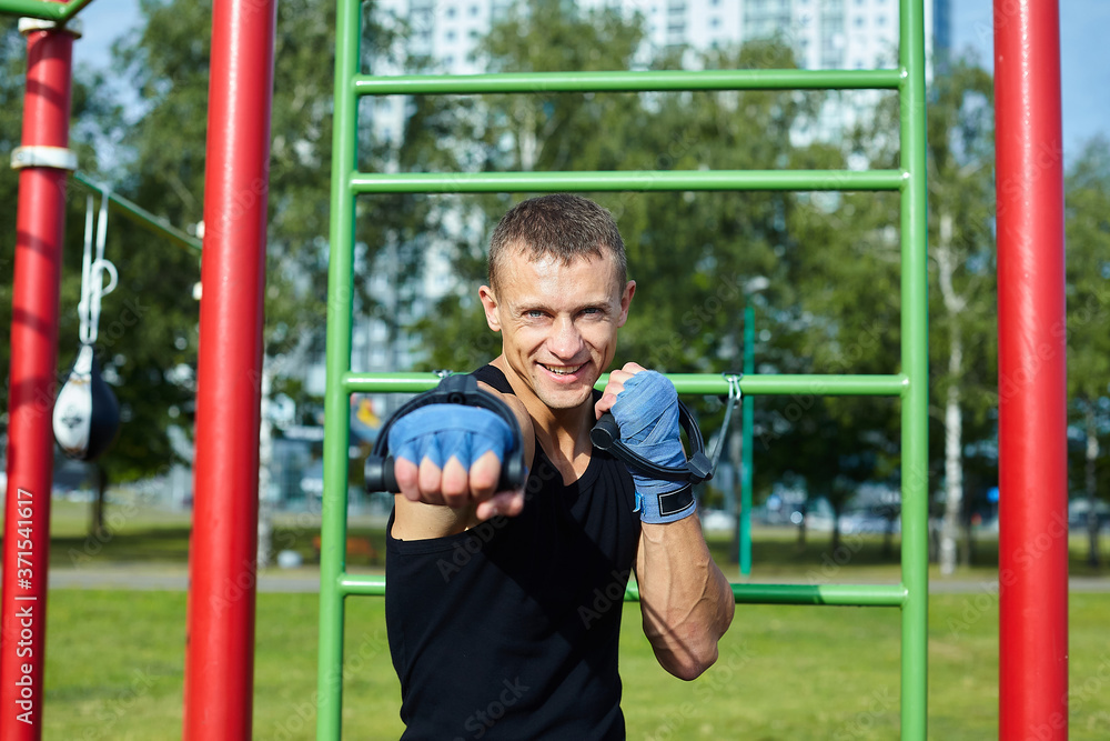 Obraz premium a boxer does training sessions in the morning on the sports field