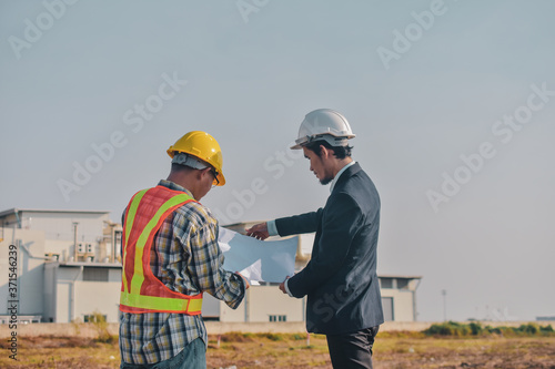 Asian man Business talking outdoor on site construction