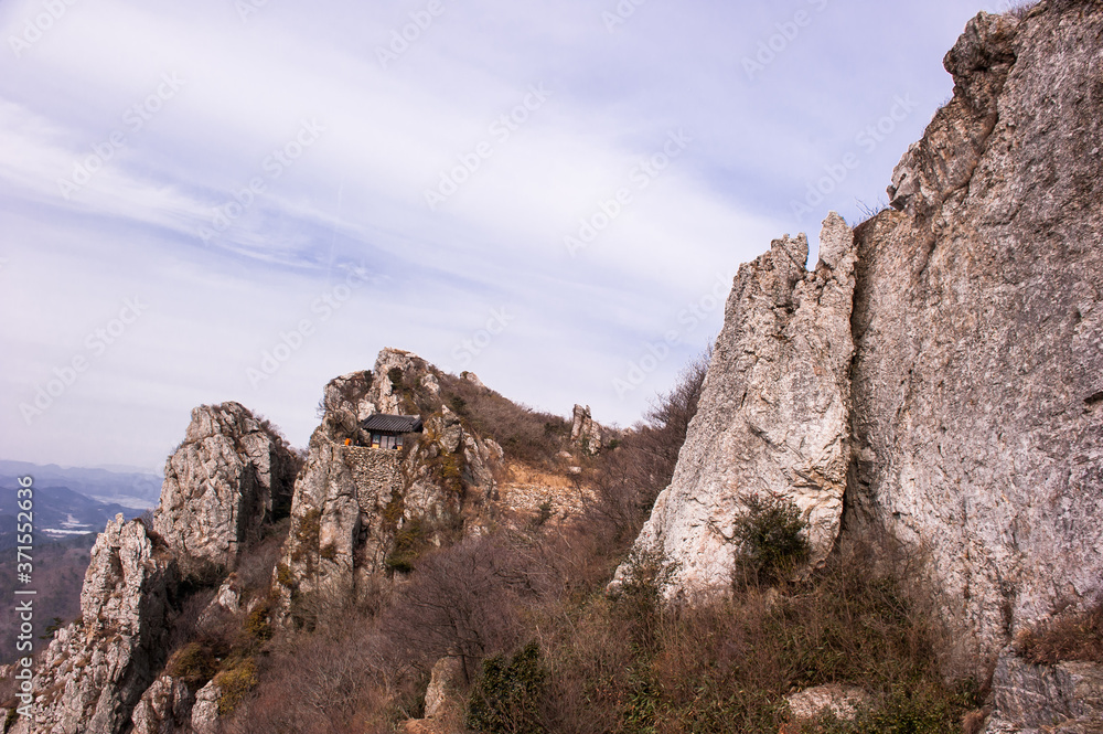 Scenic mountainscape with rock cliffs during mountain hiking.