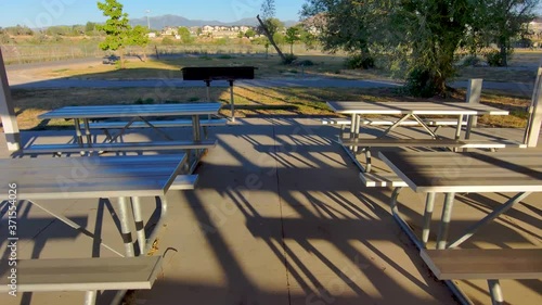 Picnic tables in an outdoor dinning pavilion - drone fly over photo