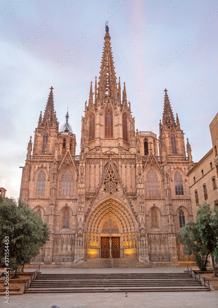 Barcelona - The facade of old gothic cathedral of the Holy Cross and Saint Eulalia at dusk.