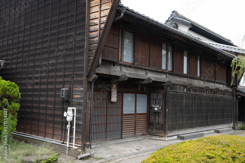 Old house with "udatsu", which is small fence of rich old Japanese house, in Unno Station on Hokkoku Road in Tomi City, Nagano Prefecture