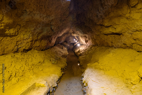 Over 2000 years old Karez Well system, ancient underground irrigation system in Turpan, Xinjiang, China. Image noisy due to high ISO. photo