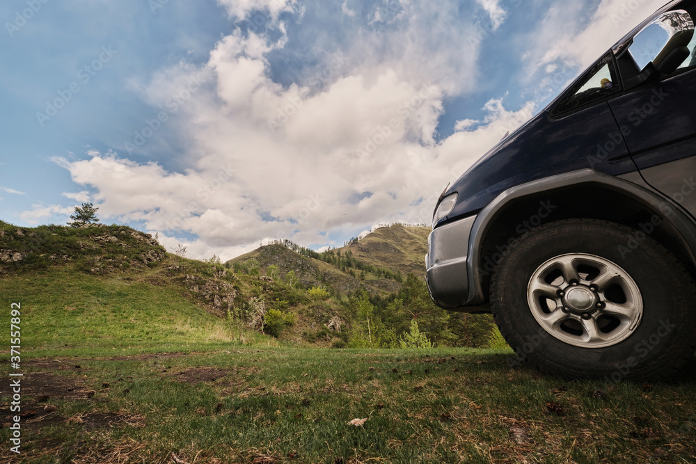 Off road car travel in beautiful high mountains, summer sunny day Off road car travel in beautiful high mountains, summer sunny day