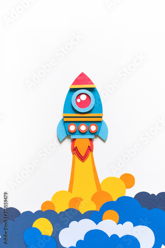 Rocket takes off paper craft. Back to school. Copy space. Business concept