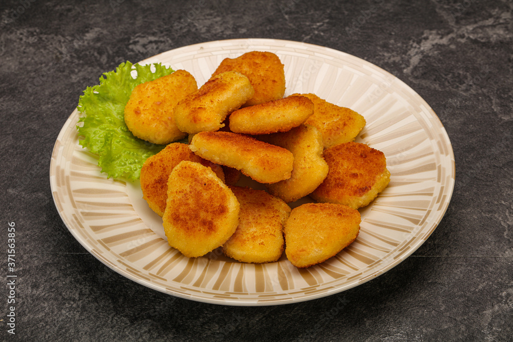 Fried chicken nuggets served salad leaves