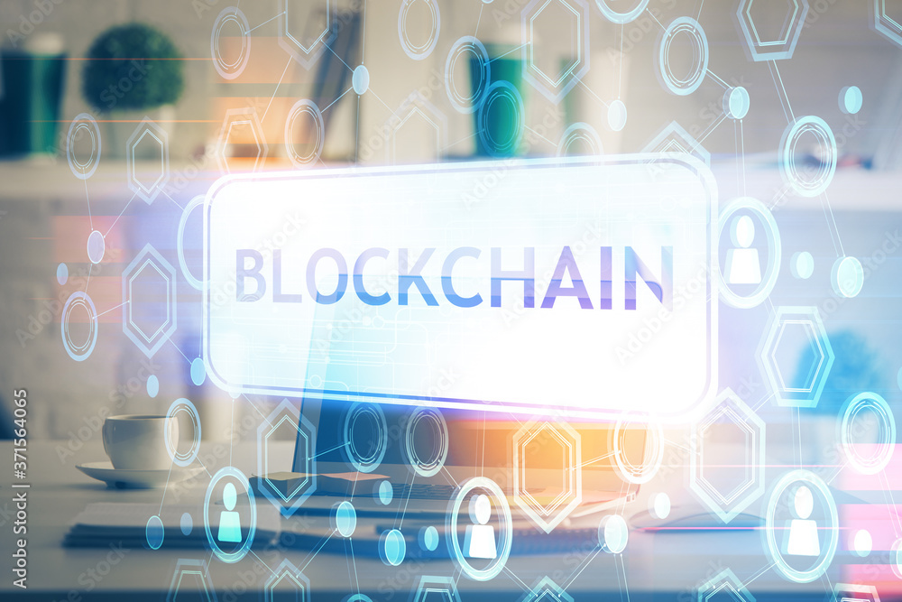 Multi exposure of blockchain theme hologram and table with computer background. Concept of bitcoin crypto currency. Multi exposure of blockchain theme hologram and table with computer background. Concept of bitcoin crypto currency.