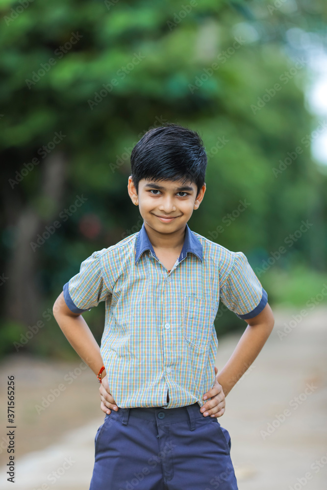 Cute little indian Indian / Asian school boy wearing uniform Cute little indian Indian / Asian school boy wearing uniform