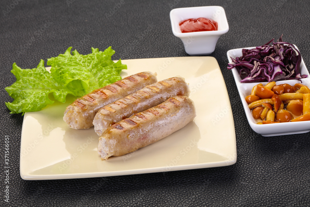 Grilled sausages served mushrooms and cabbage Grilled sausages served mushrooms and cabbage