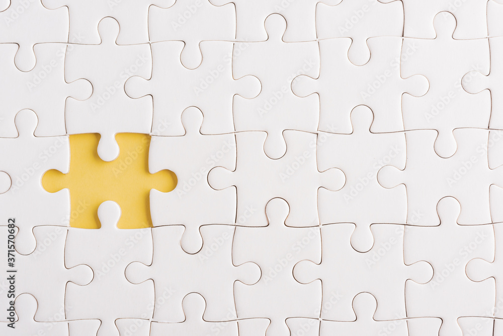 Top view flat lay of paper plain white jigsaw puzzle game texture  incomplete or missing piece, studio shot on a yellow background, quiz  calculation concept Stock Photo | Adobe Stock