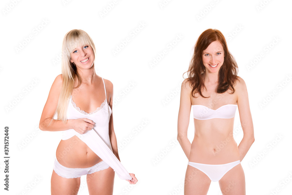 Two attractive laughing models with perfect bodys wearing white underwear, isolated on white studio background Two attractive laughing models with perfect bodys wearing white underwear, isolated on white studio background