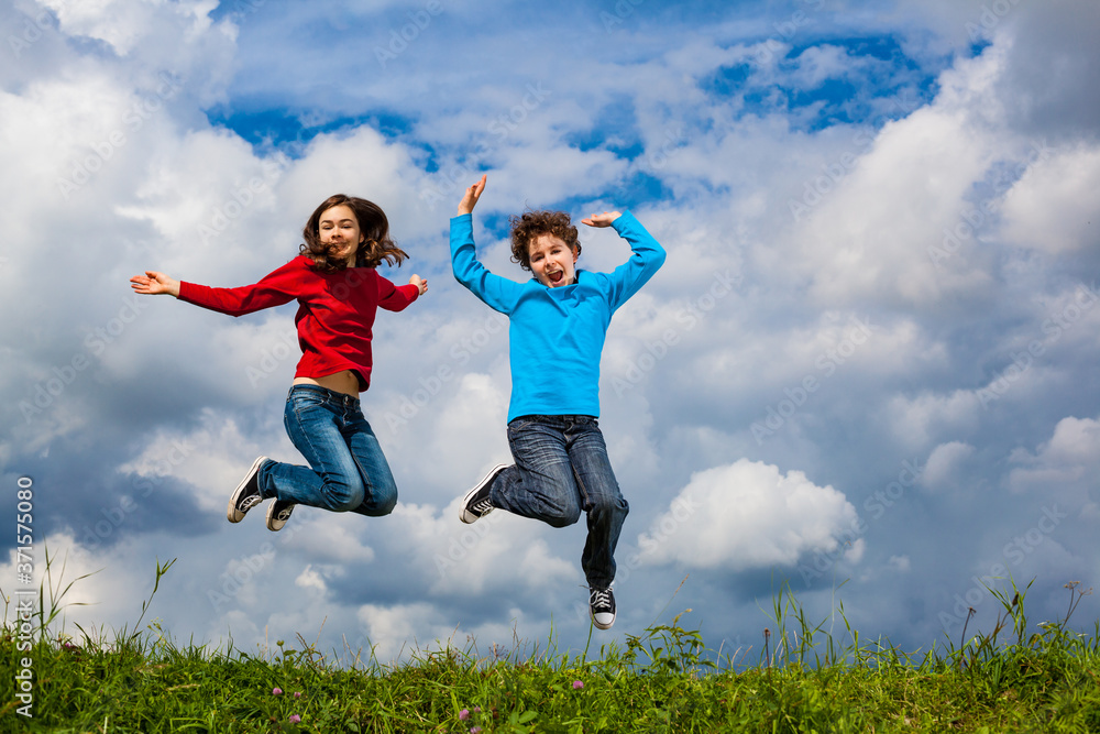 Girl and boy running, jumping outdoor
Girl and boy running, jumping outdoor