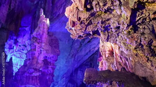 groundwater drops in colourful limestone caves full of stalactite and stalagmite in karst area of limestone in Guilin, China