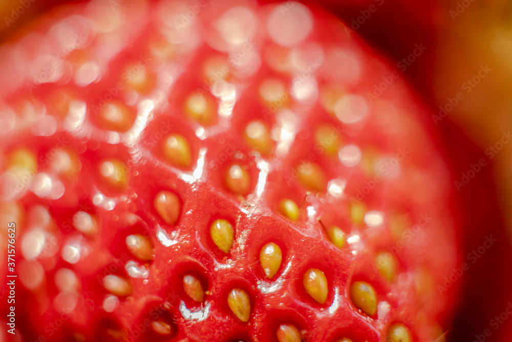 Macro photography of a red strawberry. Strawberry seeds close up Macro photography of a red strawberry. Strawberry seeds close up