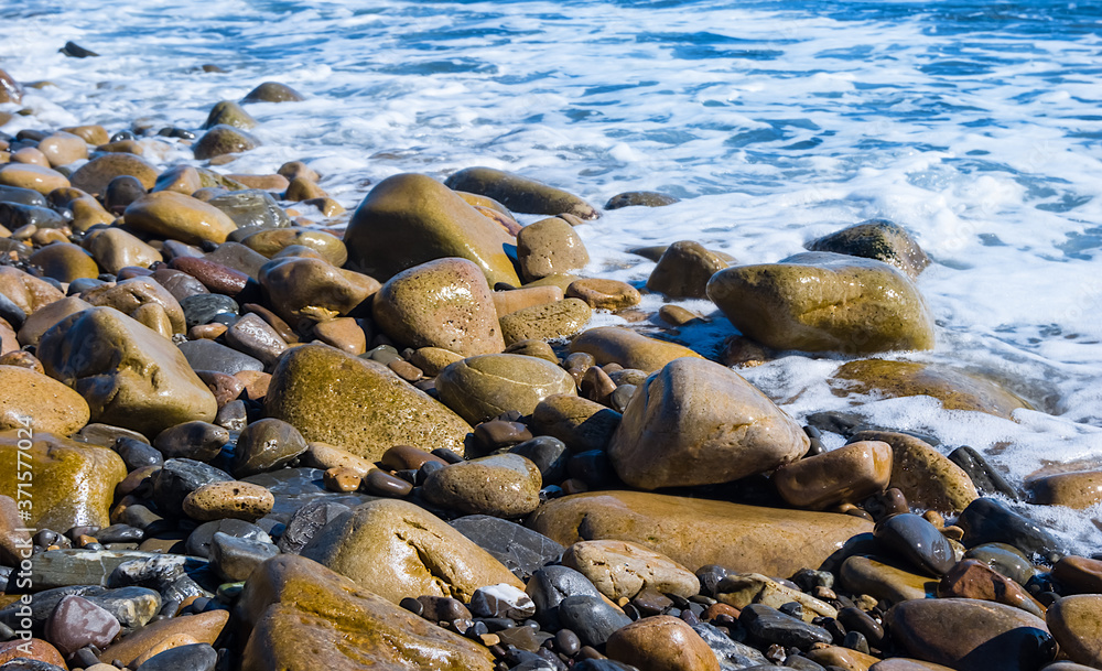 closeup stony sea beach, summer vacation scene closeup stony sea beach, summer vacation scene