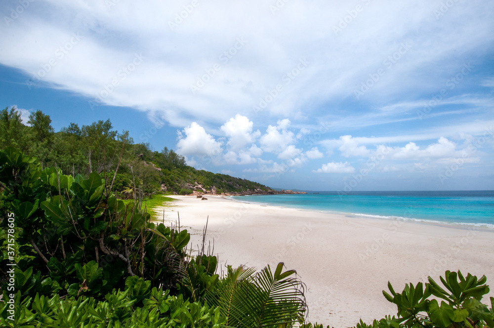 Summer scenic view of Anse Cocos sandy beach in a beautiful tropical bay. La Digue Island, Seychelles Summer scenic view of Anse Cocos sandy beach in a beautiful tropical bay. La Digue Island, Seychelles