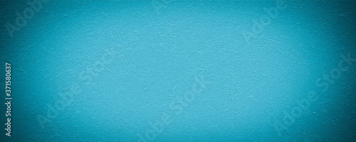 light blue background texture, dark border grunge and light cloudy center design in panoramic website banner or graphic art background
